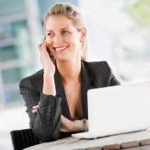 http://www.dreamstime.com/royalty-free-stock-photo-businesswoman-phone-laptop-image12816225