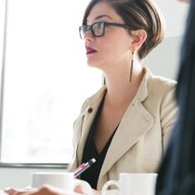 cropped-woman-in-glasses-at-meeting.jpg